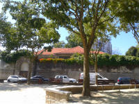 Summer view of the church roof and surrounding wall from Largo da Maternidade